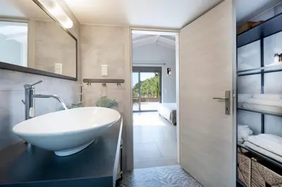 a bathroom with a sink and a mirror at Villa Levande in Sfinárion