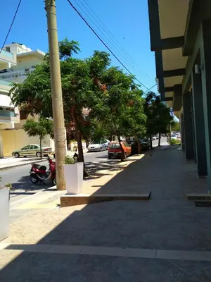 a street with trees on the side of a building at Beloni Apartments and Studios in Chania Town