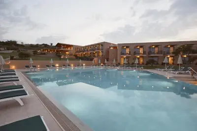 a large swimming pool in front of a hotel at Giannoulis – Santa Marina Beach Hotel in Agia Marina Nea Kydonias