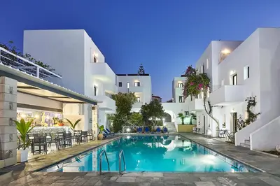 a swimming pool in the middle of a building at Eva Suites & Apartments in Agia Marina Nea Kydonias