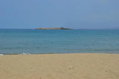 a beach with the ocean in the background at Chryssi myHome in Kato Daratso