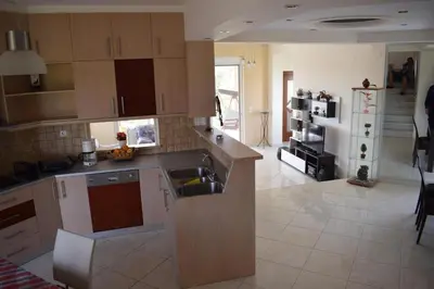 a kitchen with a sink and a counter top at ILIAS VILLA IN CHANIA in Perivólia