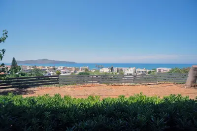 a view of the city and the ocean at Romantic Corner Maisonette houses in Stalos