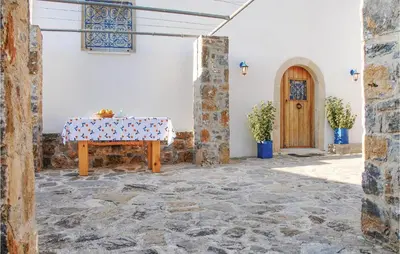 a room with a table with a table cloth on it at Amazing Home In Malaxa, Chania in Maláxa