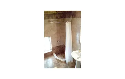 a bathroom with a shower with a toilet and a sink at Amazing Home In Malaxa, Chania in Maláxa