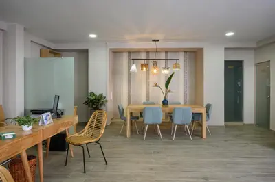 a dining room with a table and chairs at Minaret Suites and Apartments in Chania Town