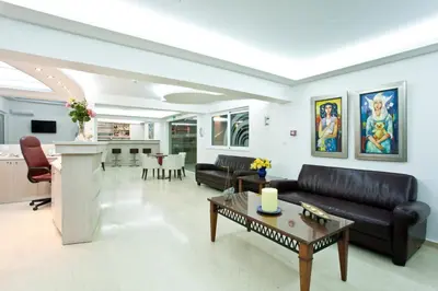 a living room with a couch and a table at Phaedra Hotel in Stalos
