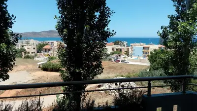 a view of the ocean from the balcony of a house at Hotel Kleopatra in Stalos