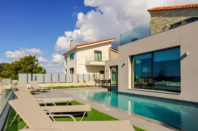 a villa with a swimming pool and a house at Eland Dream Villas in Kalamaki Chanion