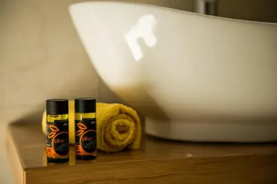 two bottles of hair products sitting on top of a table at Thea Thalassa in Kalamaki Chanion
