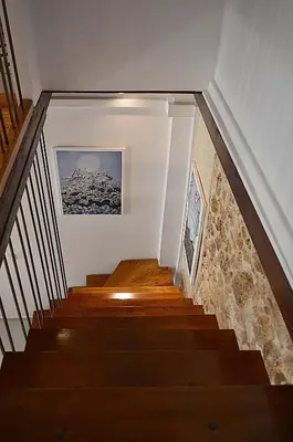 a staircase in a house with a picture on the wall at Casa al Bocca del Porto in Chania Town