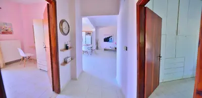 a hallway with a room with a bed and a mirror at Eliana in Kissamos