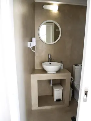 a bathroom with a sink and a mirror at Georgia in Palaiochóra