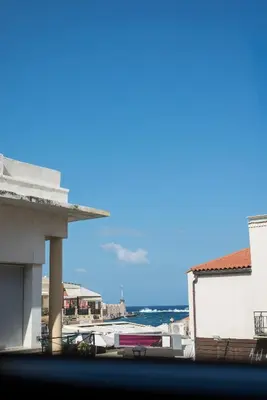 a view of the ocean from a building at Nonnalena Boutique Hotel in Chania Town