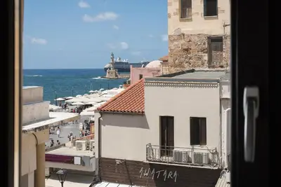 a view of a city with the ocean in the background at Nonnalena Boutique Hotel in Chania Town