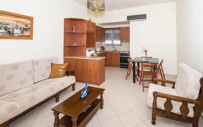 a living room with a couch and a table at Xirouchakis farm in Kissamos