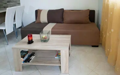 a living room with a table and a couch at Xirouchakis farm in Kissamos