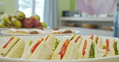 a group of sandwiches on a plate on a table at Waterlily Hotel Apartments in Kalathas