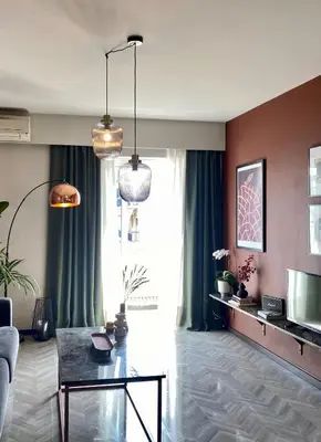 a living room with a couch and a table at TESSERA Urban Chania in Chania Town