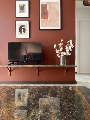a living room with a fireplace and a television at TESSERA Urban Chania in Chania Town