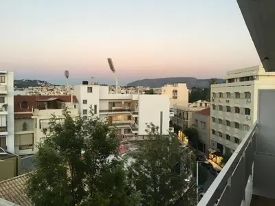 a view of the city from the balcony of a building at DYO Urban Chania in Chania Town