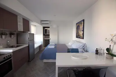 a small kitchen with a bed in a room at DYO Urban Chania in Chania Town