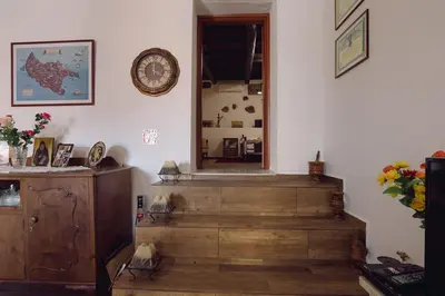 a room with stairs and a clock on the wall at Villa Roxani in Mesklá
