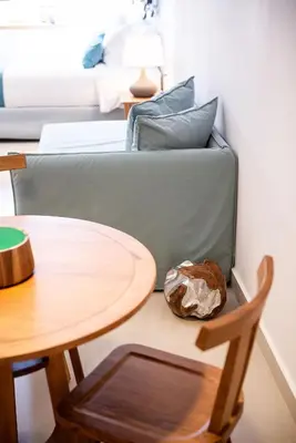 a living room with a couch and a table at Avra Apartments Venetian Harbour in Chania Town