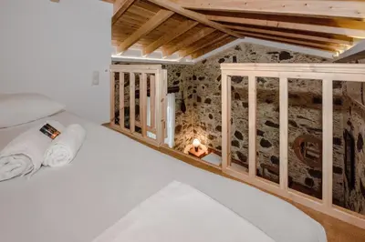a room with a bed and a fireplace at Fairytale Elafonisi in Elafonisi