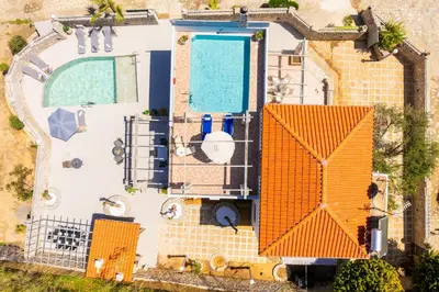an aerial view of a house with a swimming pool at Villa Melina in Tavronitis