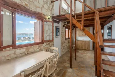 a room with a bed and a window at Souda Bay View in Kalami
