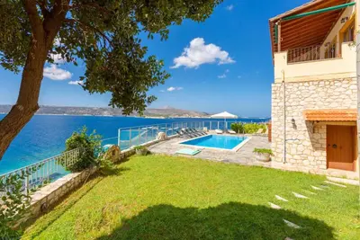 a villa with a view of the water at Souda Bay View in Kalami