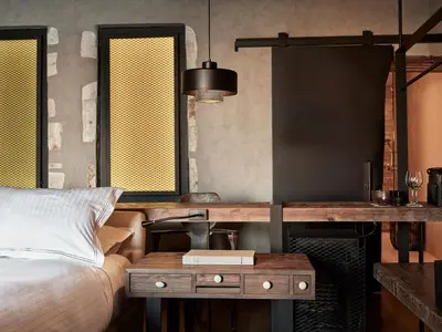 a bedroom with a bed and a table with a bed sqor at Domus Fresco in Chania Town
