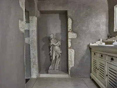 a statue of a man hugging a woman in a bathroom at Domus Fresco in Chania Town