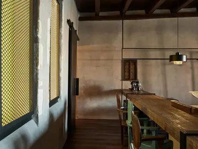 a kitchen with a long wooden table and chairs at Domus Fresco in Chania Town