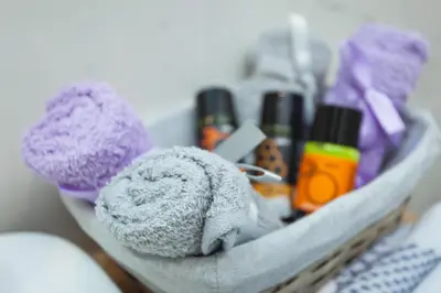 a tray with towels and cosmetics on a table at Nival Luxury Suites in Chania Town