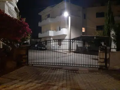 a gate in front of a building at night at Estrella Studios in Chania Town
