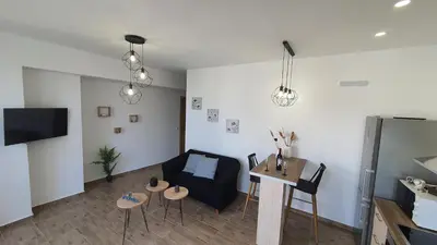 a living room with a couch and a table at Elizabeth Suites in Kato Daratso