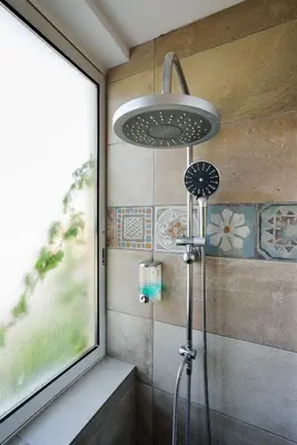 a shower with a shower head in a bathroom at Elma's Dream Apartments & Villas in Kato Daratso