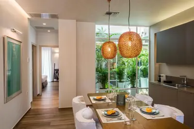 a kitchen and dining room with a table and chairs at No17 Pireos Street in Chania Town