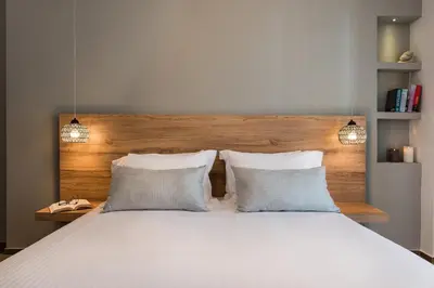a bedroom with a large white bed with two pillows at No17 Pireos Street in Chania Town