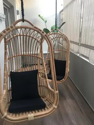 a couple of wicker swings in a room at No17 Pireos Street in Chania Town