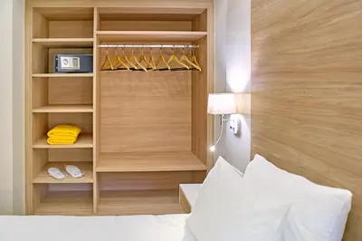a bedroom with a bed and a closet at Emmanouela's Apts in Kissamos