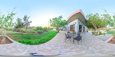 a building with a table and chairs in front of it at Panorama in Elafonisi