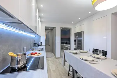 a kitchen with a table with plates on it at Aenaon Seaview Villa in Plataniás