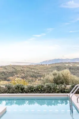 a swimming pool with a view of the desert at Apithano Heated pool on demand in Spiliá