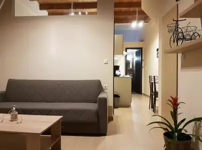 a living room with a couch and a table at Agora Apartments Ground Floor in Kissamos
