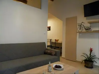 a living room with a couch and a table at Agora Apartments Ground Floor in Kissamos