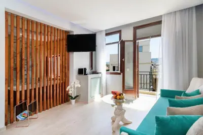 a living room with a couch and a table at Diamond Luxury Suites in Chania Town