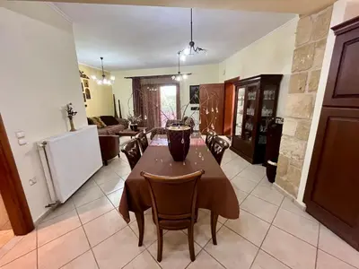 a dining room with a table and chairs at Rosmarino in Kissamos